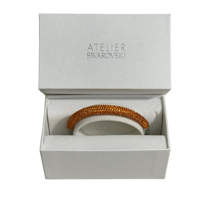 Swarovski atelier Tigris bangle Orange, Rhodium plated